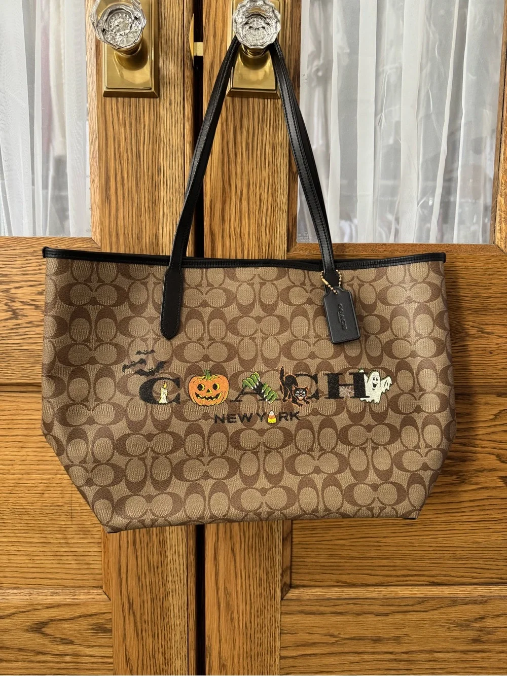 Coach Brown Signature Canvas Tote with Black Straps and Halloween Motifs
